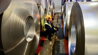 File photo dated 15/02/17 of a worker inspecting rolls of steel. Massive US tariffs on EU steel imports came into force on Friday as Britain made it clear a trans-Atlantic trade war would be bad for both sides.