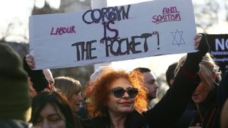 Protesters gather in Parliament Square, Westminster