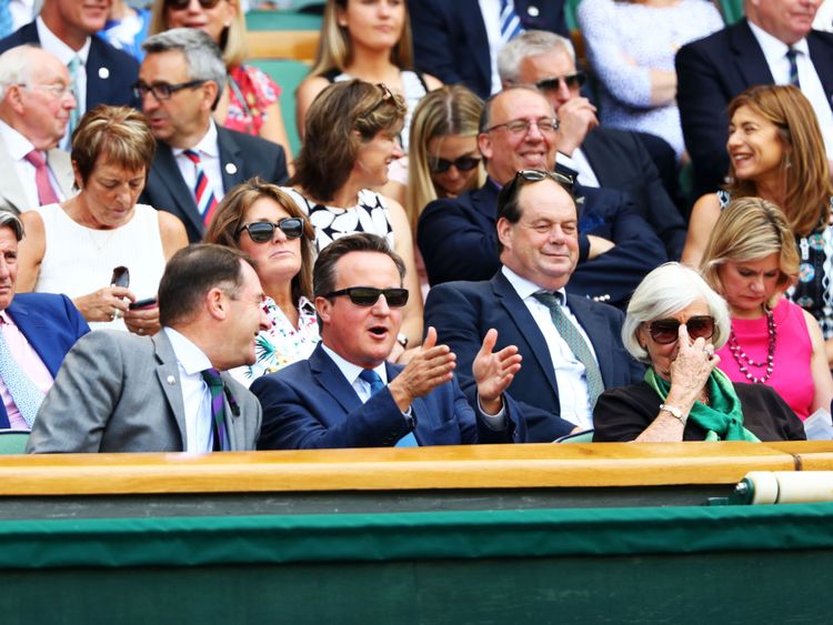 Mr Cameron regularly takes his mother (right) to the championships at the All England Club