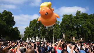 A &#39;Baby Trump&#39; balloon rises after being inflated in London&#39;s Parliament Square