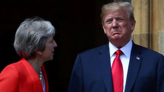 Theresa May poses for a photograph with U.S. President Donald Trump at Chequers 