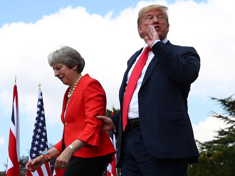 Theresa May and Donald Trump walk away after holding a joint news conference at Chequers