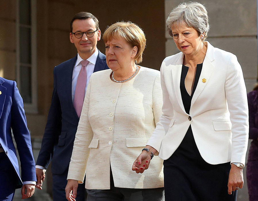 Theresa May has met Angela Merkel only hours after the Cabinet's Brexit turmoil