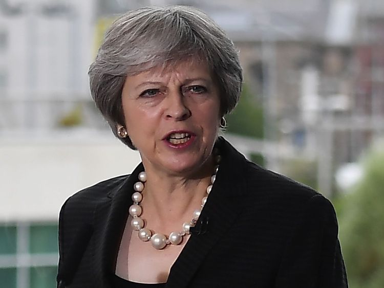 Theresa May delivers a keynote speech at the Waterfront Hall in Belfast