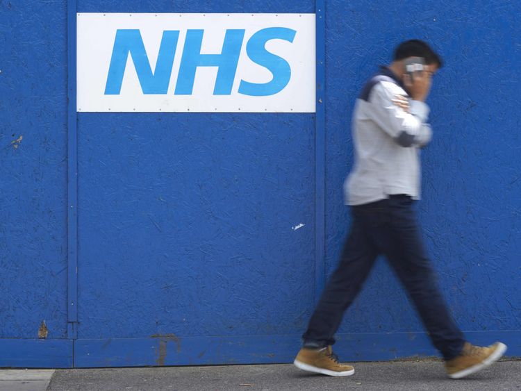 A man walks past an NHS signage outside The Royal London Hospital in London on May 14, 2017. The unprecedented global cyberattack has hit more than 200,000 victims in scores of countries, Europol said on May 14, 2017, warning that the situation could escalate when people return to work. In Britain, the attack disrupted care at National Health Service facilities, including The Royal London Hospital, part of the largest NHS Trust in England. / AFP PHOTO / Niklas HALLE&#39;N (Photo credit should read N