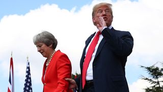 Theresa May and Donald Trump walk away after holding a joint news conference at Chequers