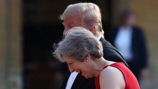 Donald Trump and Theresa May hold hands