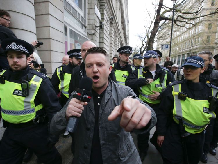 Stephen Christopher Yaxley-Lennon, AKA Tommy Robinson, former leader of the right-wing EDL (English Defence League) is escorted away by police from a Britain First march and an English Defence League march in central London on April 4, 2017