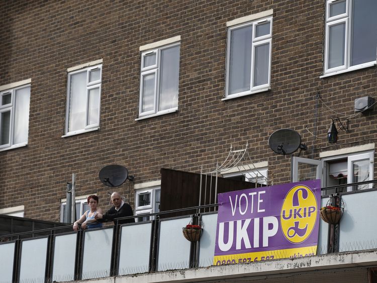 Onlookers watch the activity below them as Nigel Farage of UKIP visits the constituency of Thurrock in Essex, during an election campaign visit to the area,