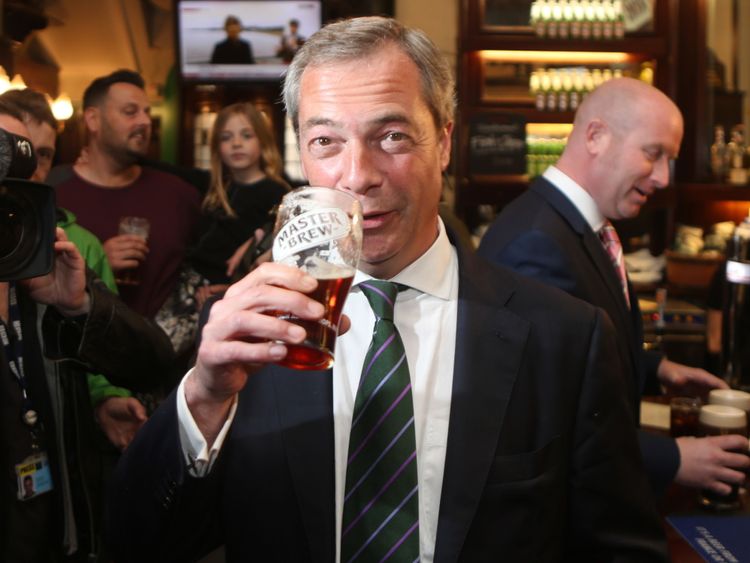 Ukip leader Nigel Farage has a pint in the Westminster Arms, London, as he celebrates his party&#39;s results in the polls for the European Parliament. 