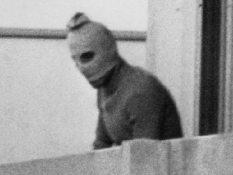 MUNICH, GERMANY - SEPTEMBER 5, 1972: (FILE PHOTO) One of the eight Palestinian terrorists comprising the Black September group stands on a balcony of the Olympic village during a standoff after they kidnapped nine members of the Israeli Olympic team and killed two others September 5, 1972 in Munich, Germany.