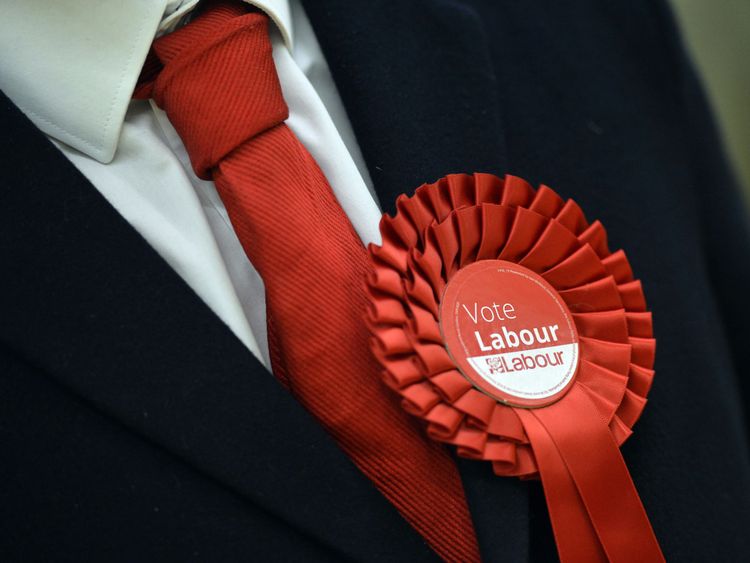 A Labour Party supporter wears a rosette in support of the political party during the election count for Basildon at the Sports Village in Basildon, Essex. PRESS ASSOCIATION Photo. Picture date: Friday May 6, 2016. See PA story POLITICS Election. Photo credit should read: Hannah McKay/PA Wire .