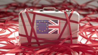 Red tape around a briefcase with european and british flags 