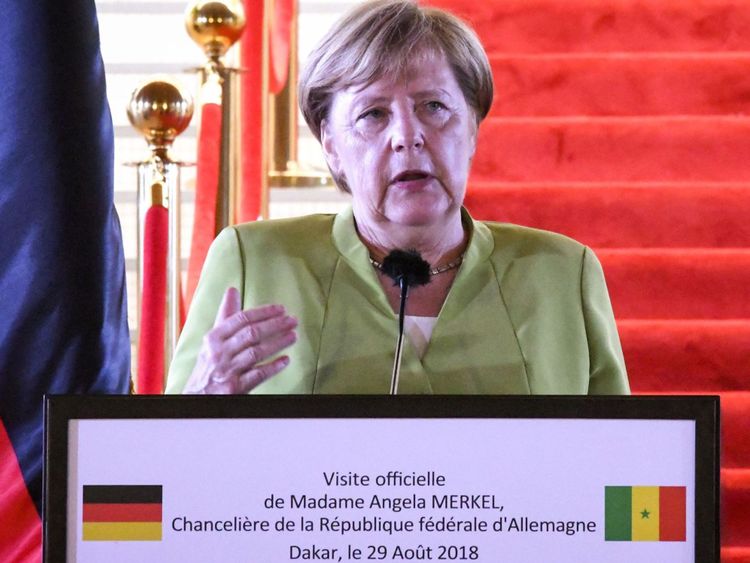 Germany&#39;s Chancellor Angela Merkel speaks during a joint press conference with Senegal&#39;s President after their meeting, on August 29, 2018 in Dakar, the first stop on a three country tour of Africa which also includes Ghana and Nigeria. (Photo by SEYLLOU / AFP) (Photo credit should read SEYLLOU/AFP/Getty Images)
