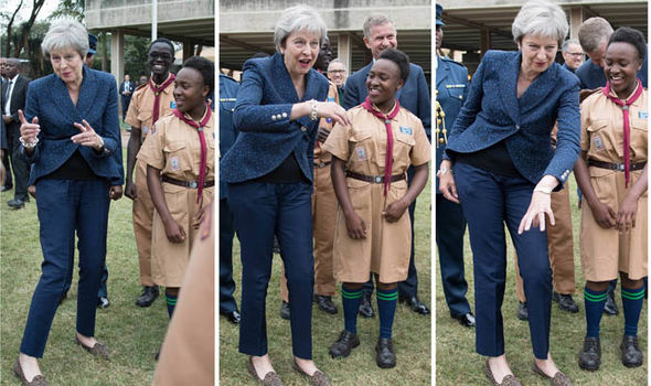 PM Theresa May dancing with the scouts in a meeting in Kenya