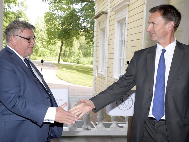 Finland&#39;s Foreign Minister Timo Soini and Britain&#39;s Foreign Secretary Jeremy Hunt shake hands as they attend a joint news conference in Vantaa, Finland August 14, 2018. LEHTIKUVA/Vesa Moilanen/via REUTERS ATTENTION EDITORS - THIS IMAGE WAS PROVIDED BY A THIRD PARTY. NO THIRD PARTY SALES. FINLAND OUT.