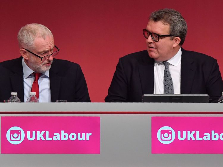 Labour Party leader Jeremy Corbyn (L) sits alongside deputy leader Tom Watson at the Labour Party conference in 2017