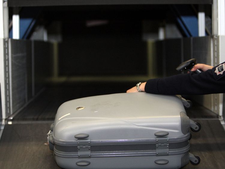 A UK Border Agency officer uses the new  xylon machine at Heathrow Airport. PRESS ASSOCIATION Photo. Picture date: Thursday January 6, 2011 See PA story . Photo credit should read: Steve Parsons/PA Wire