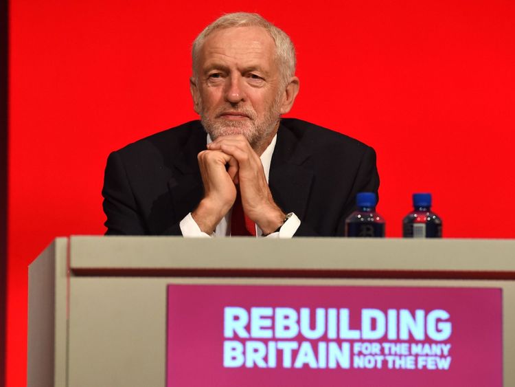 Labour leader Jeremy Corbyn listens to a speech at the party conference in Liverpool