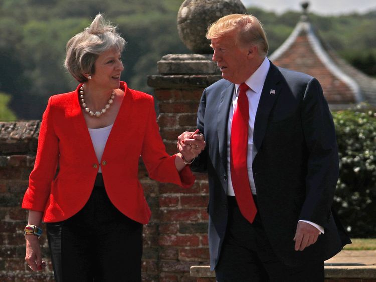 Britain&#39;s Prime Minister Theresa May and U.S. President Donald Trump walk to a joint news conference at Chequers, the official country residence of the Prime Minister, near Aylesbury, Britain, July 13, 2018