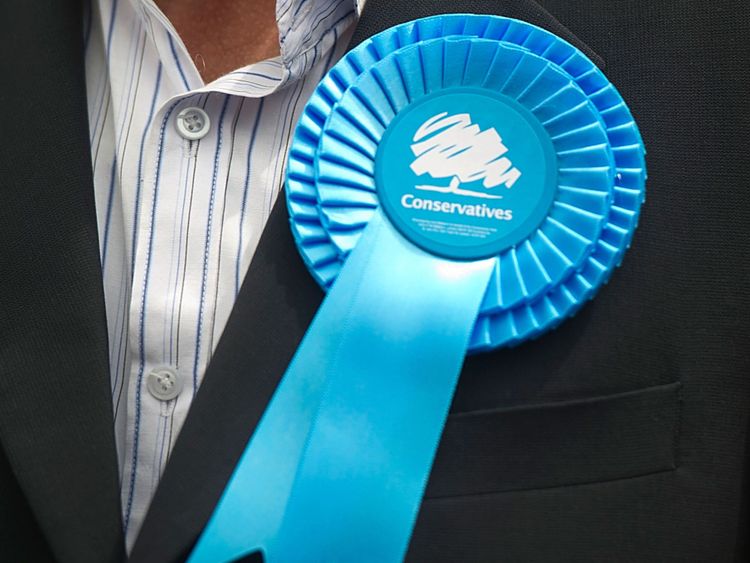 EALING, ENGLAND - MAY 21: A supporter&#39;s Conservative rosette on May 21, 2014 in Ealing, England. The rally comes in the final day of campaigning before polls open for the European Parliament election tomorrow. (Photo by Bethany Clarke/Getty Images)
